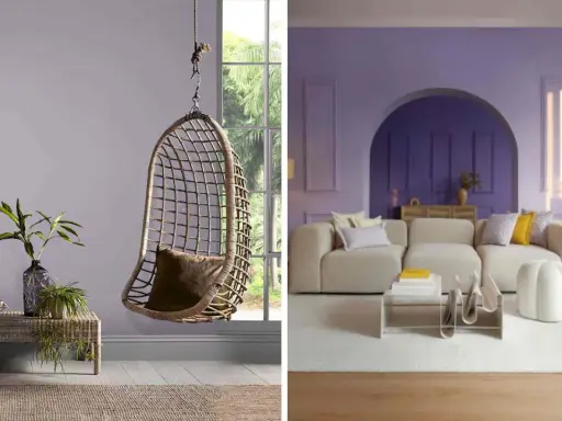 Un fauteuil suspendu en rotin et un salon moderne aux murs couleur parme clair.