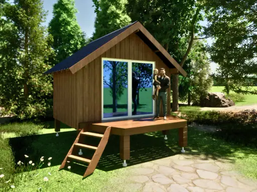 Un homme porte sa fille sur la terrasse d'un abri de jardin sur plot, entouré de verdure.